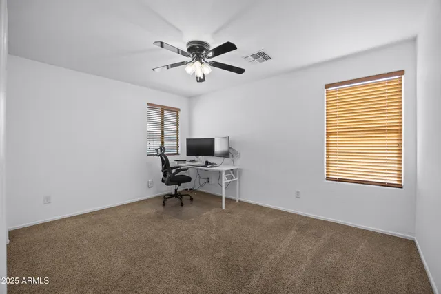 a spacious bathroom with a double vanity sink and a bathtub
