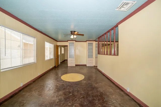 a view of livingroom with furniture wooden floor and windows