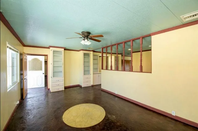 a kitchen with granite countertop a stove and a refrigerator