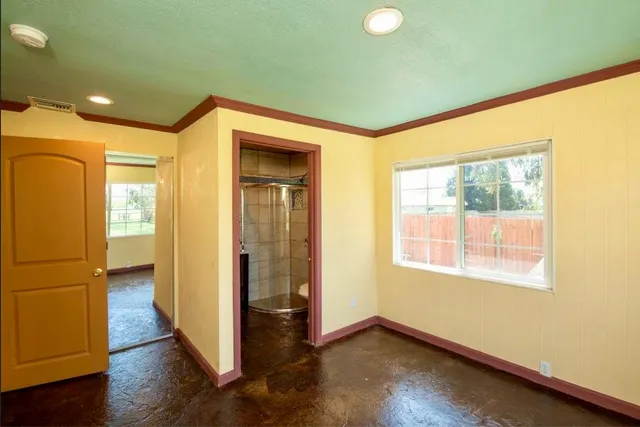 a bathroom with a toilet and shower