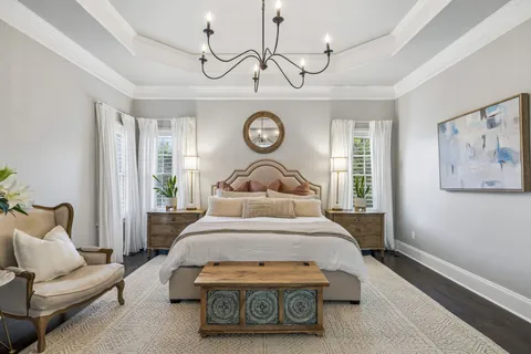 a spacious bedroom with a bed and a fireplace