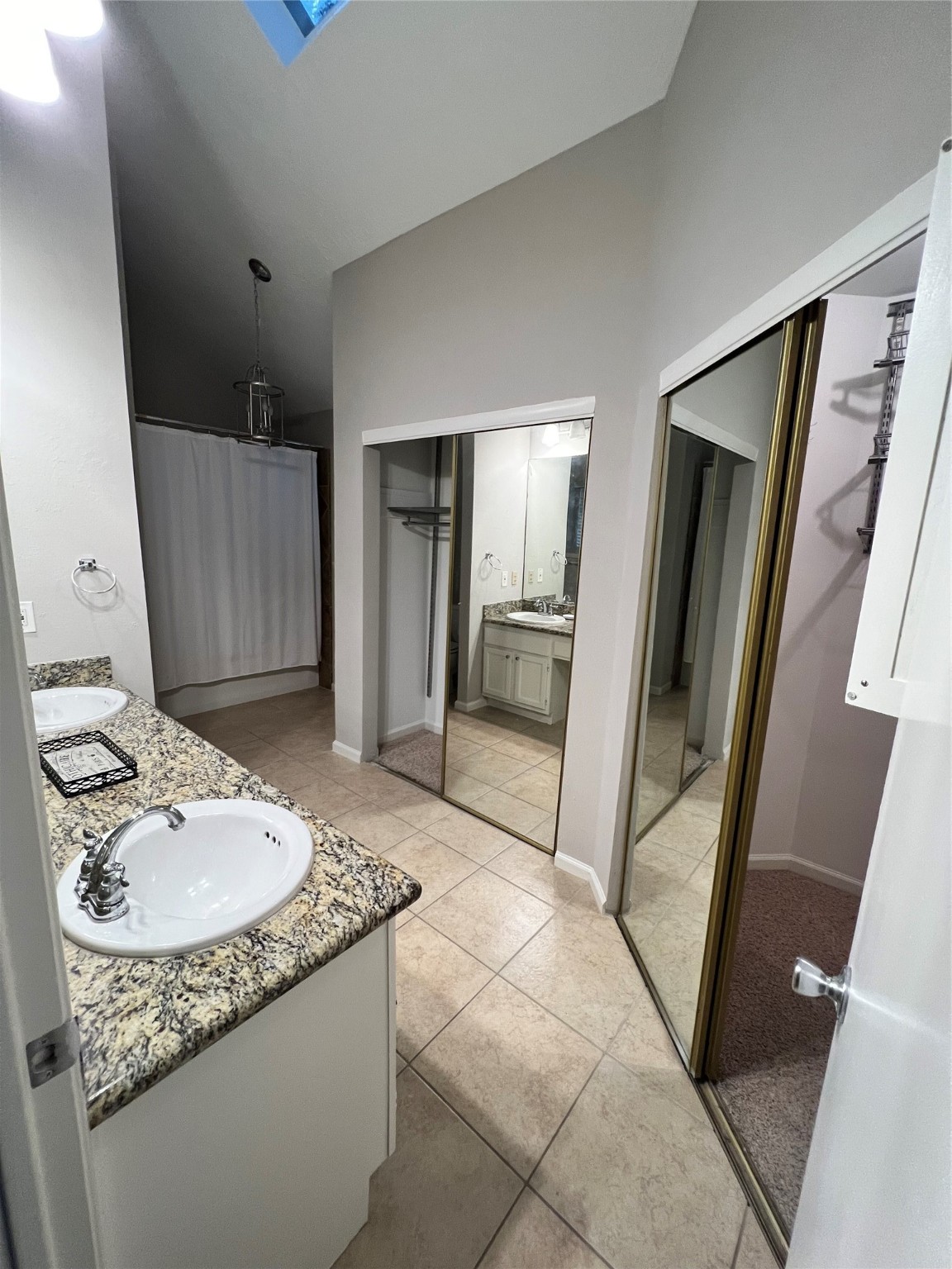 5 Spurwood Court The Woodlands, TX 77381 - Photo 11 of 16 a bathroom with a sink and a mirror