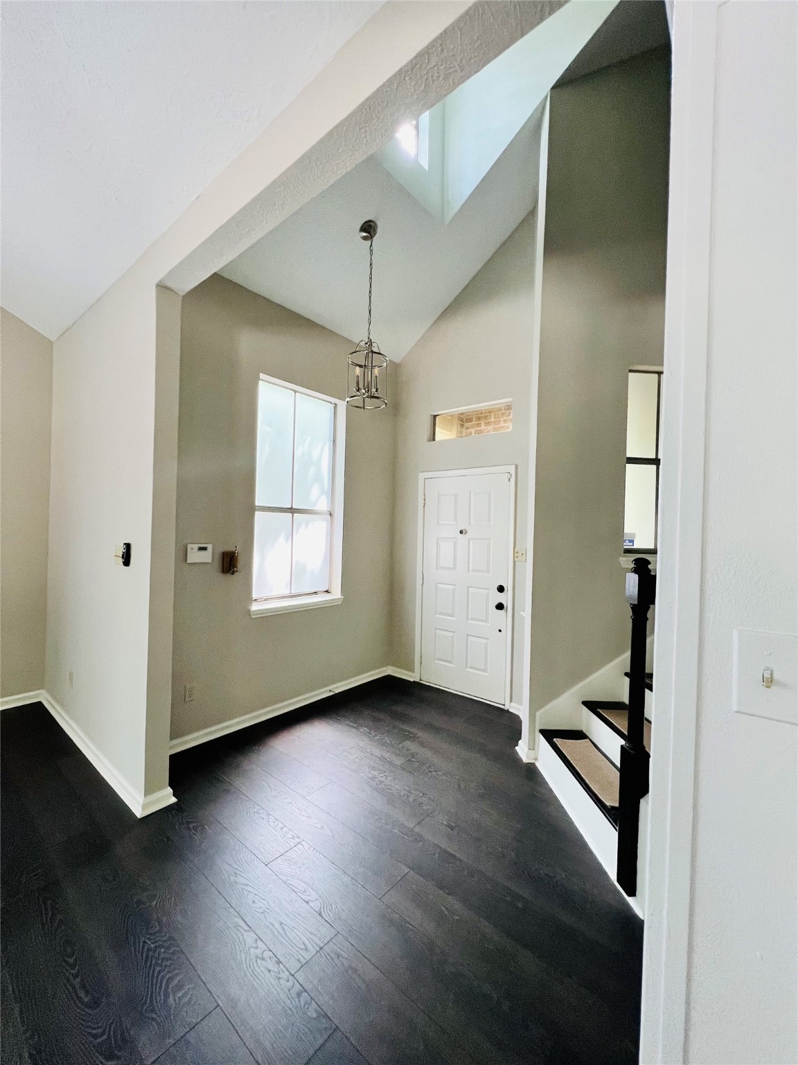 5 Spurwood Court The Woodlands, TX 77381 - Photo 5 of 16 a view of entryway with window and wooden floor