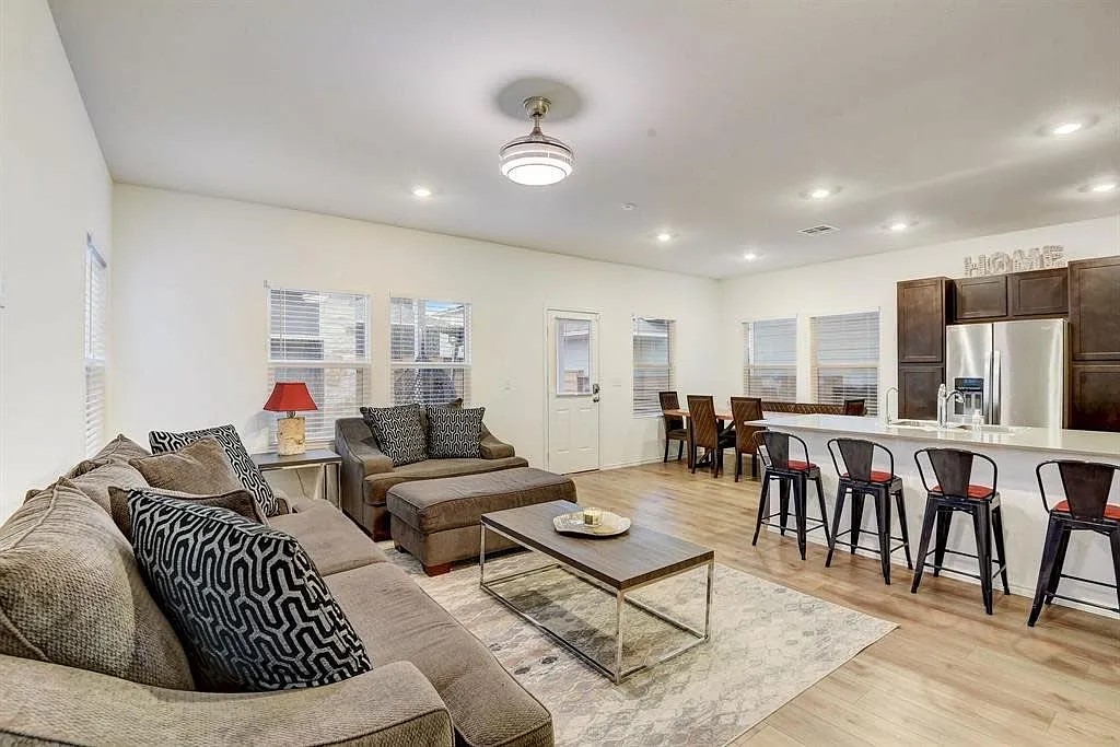 171 Santa Julia Kyle, TX 78640 - Photo 12 of 18 Living area featuring light wood-style floors and recessed lighting
