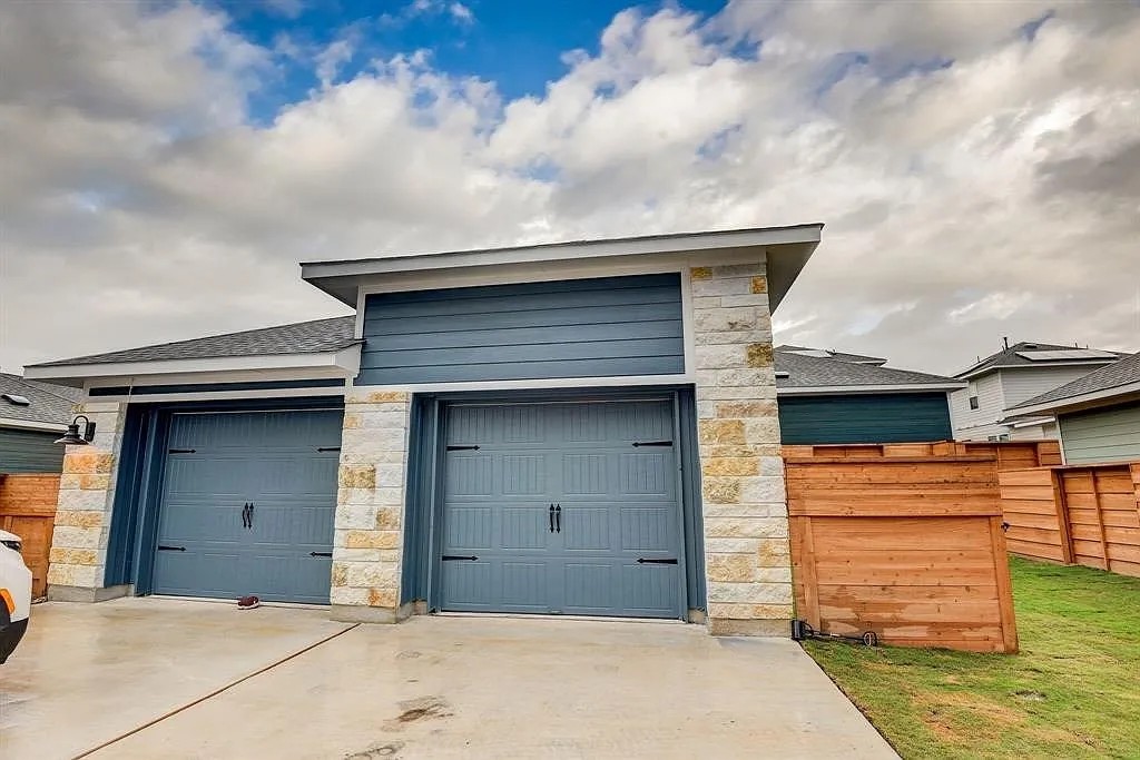 171 Santa Julia Kyle, TX 78640 - Photo 3 of 18 Garage with concrete driveway
