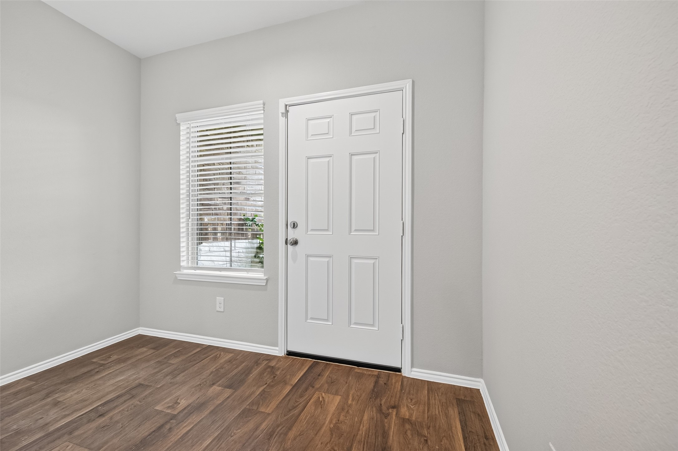 23318 Pelham Prairie Lane Spring, TX 77373 - Photo 7 of 50 an empty room with wooden floor and windows