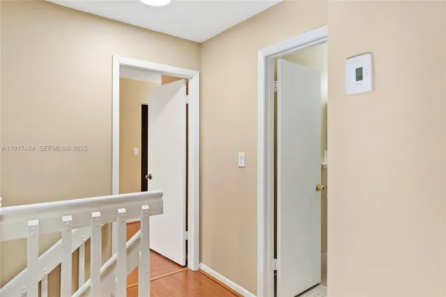 a view of a hallway with front door