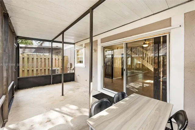 a bedroom with a bed and glass door