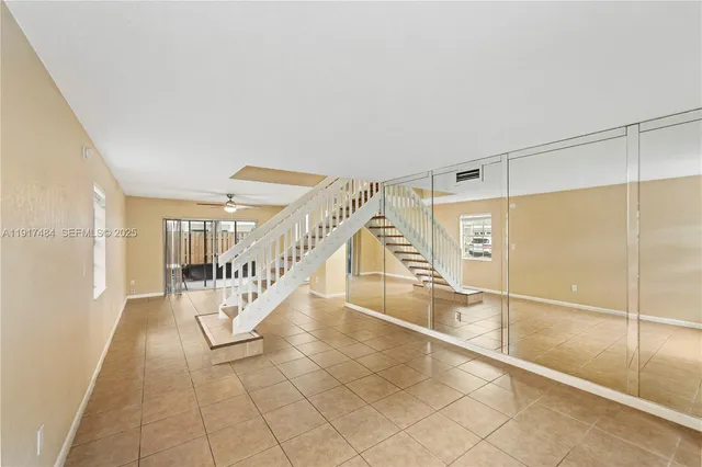 a view of entryway and hall with a rug