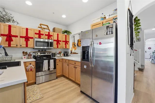 a view of an entryway with wooden floor