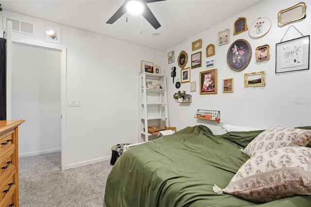 a bathroom with a sink a toilet and shower curtain