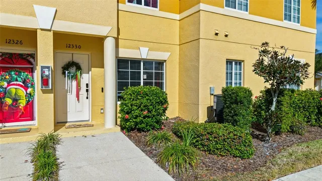 a living room with furniture and a book shelf