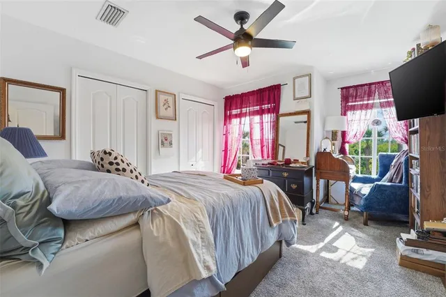 a bedroom with bed and window