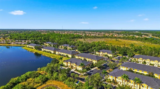 a view of a patio with table and chairs and potted plants
