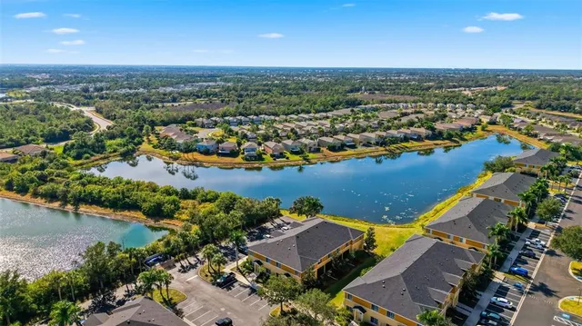 an aerial view of a house with a lake view