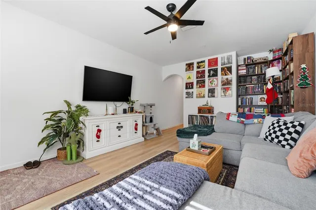 a living room with furniture and a flat screen tv
