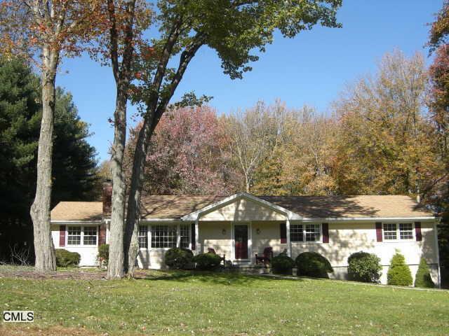 8 Brookhedge Road Trumbull, CT 06611 - Photo 1 of 1 a front view of a house with a garden