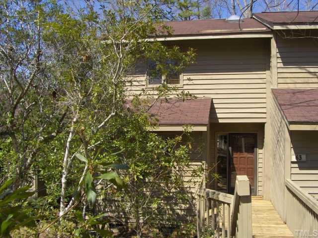 a view of a house with a tree