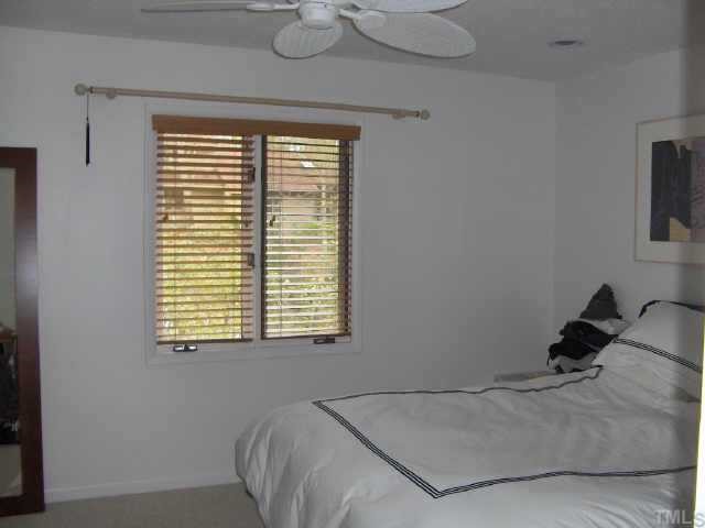 63 Stoneridge Road Durham, NC 27705 - Photo 8 of 9 a bed sitting in a bedroom next to a window