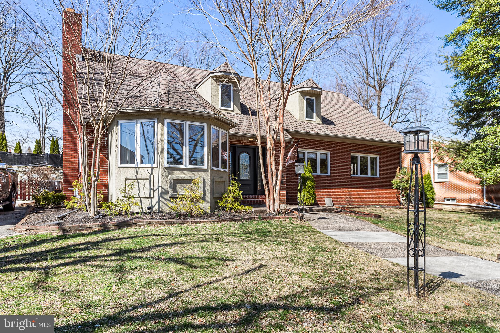 118 Powell Road Springfield, PA 19064 - Photo 1 of 33 a front view of a house with a yard