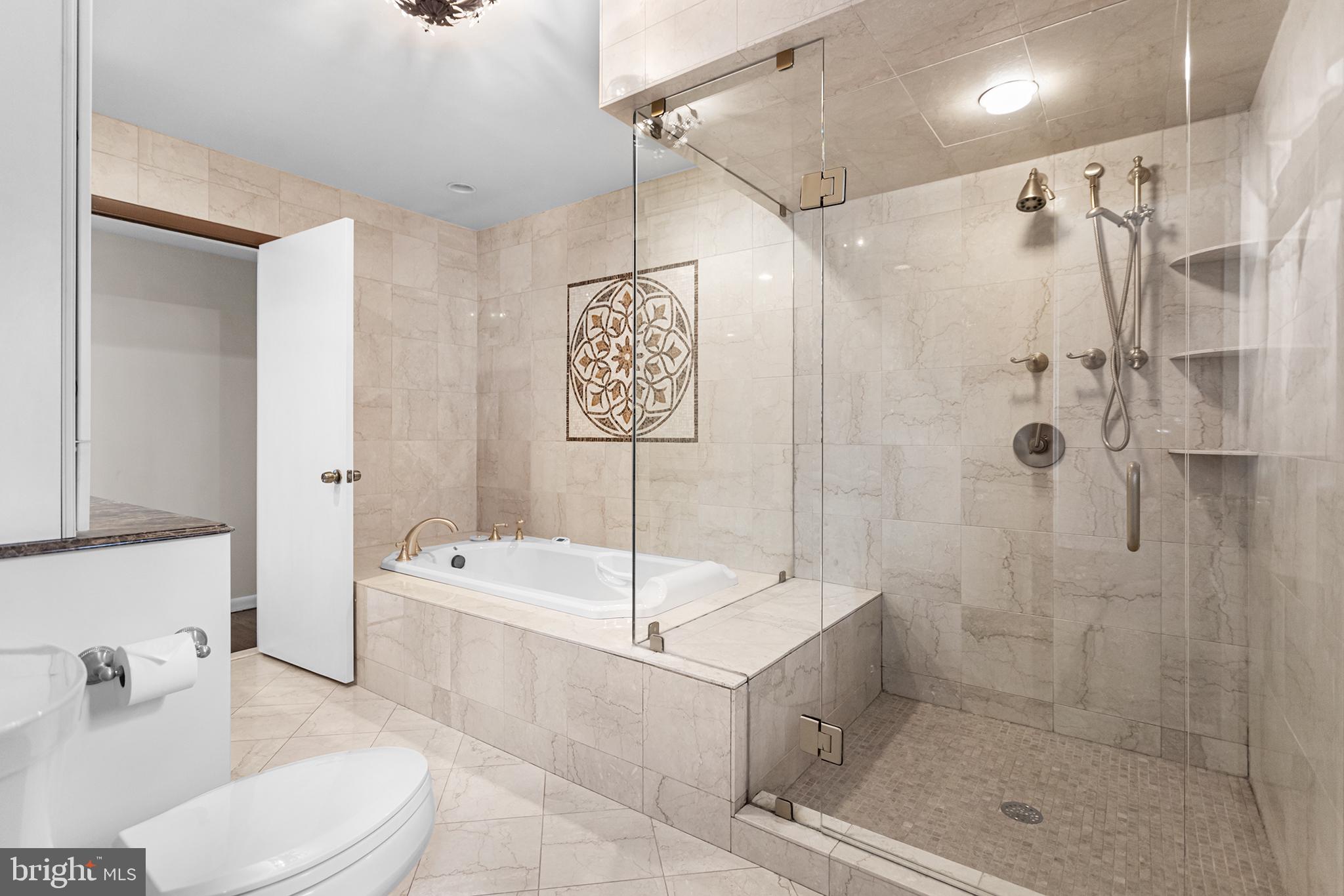 118 Powell Road Springfield, PA 19064 - Photo 12 of 33 a bathroom with a sink a toilet and shower
