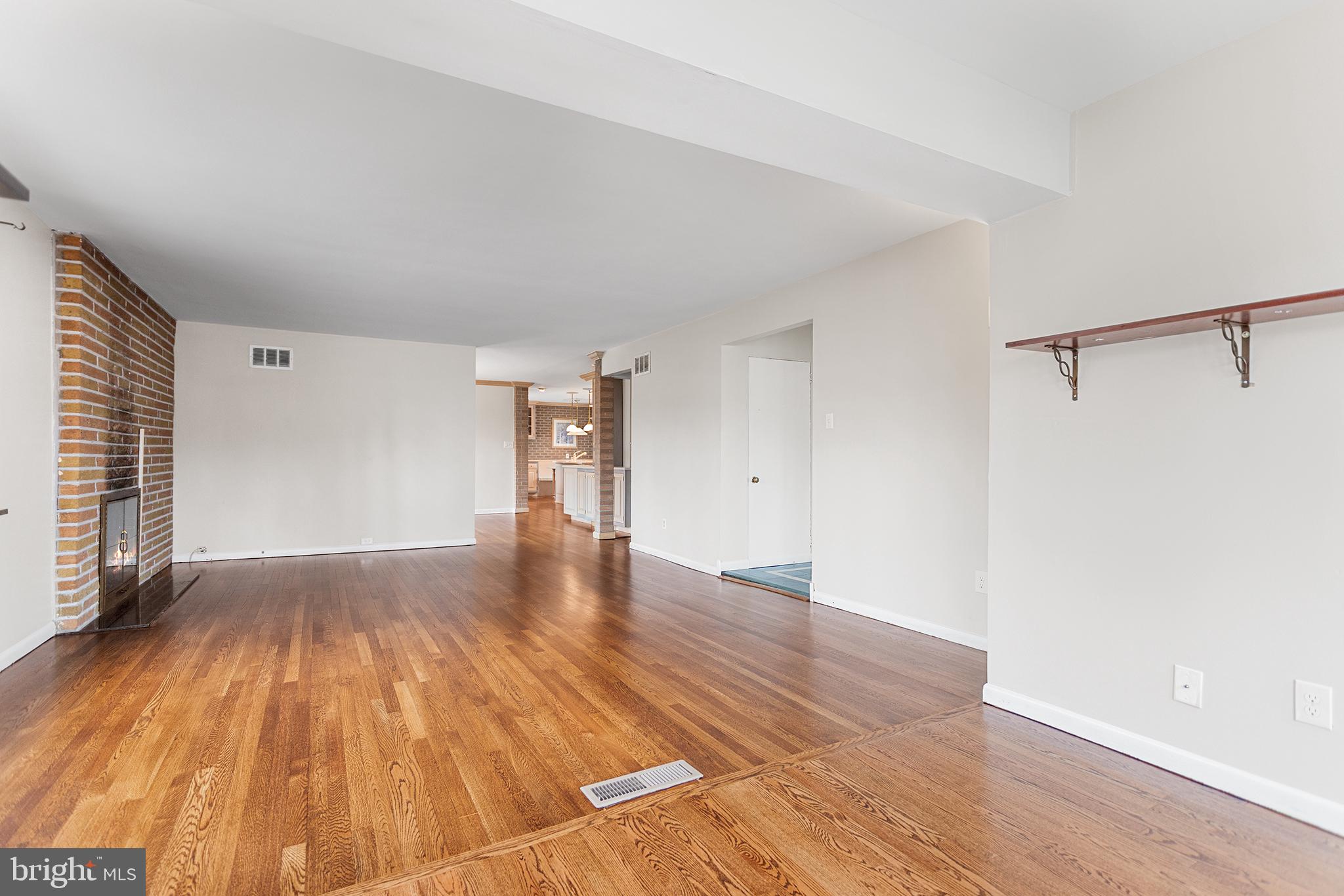 118 Powell Road Springfield, PA 19064 - Photo 3 of 33 a view of empty room with wooden floor and fan