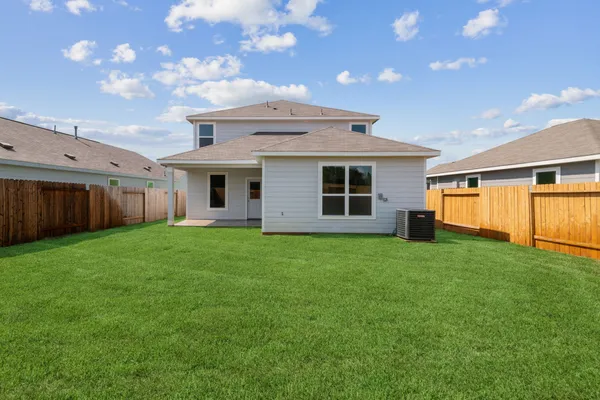 a view of a backyard with plants and a backyard