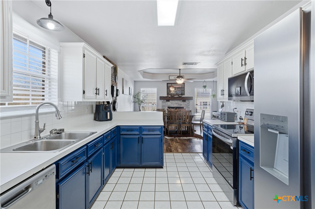 1601 Citation Loop Harker Heights, TX 76548 - Photo 18 of 42 a kitchen with stainless steel appliances granite countertop a sink stove and refrigerator