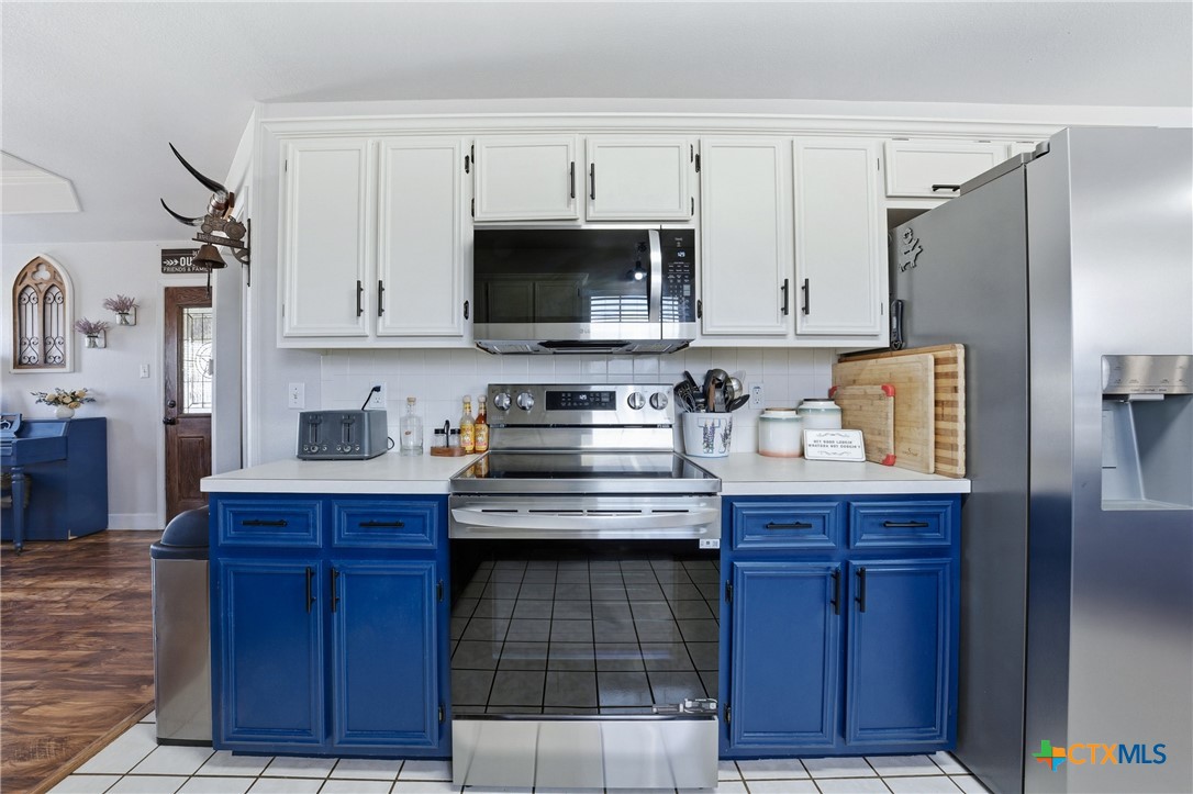 1601 Citation Loop Harker Heights, TX 76548 - Photo 20 of 42 a kitchen with stainless steel appliances granite countertop a stove a sink and a refrigerator