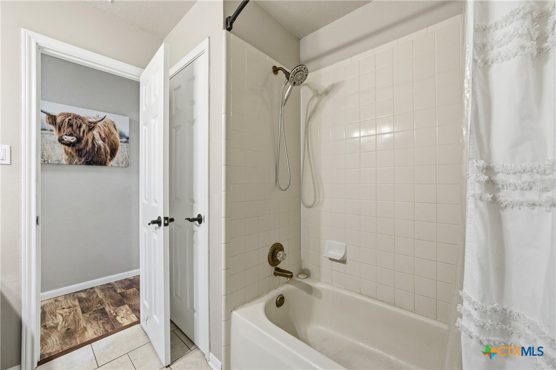 1601 Citation Loop Harker Heights, TX 76548 - Photo 26 of 42 a bathroom with a tub shower and a sink