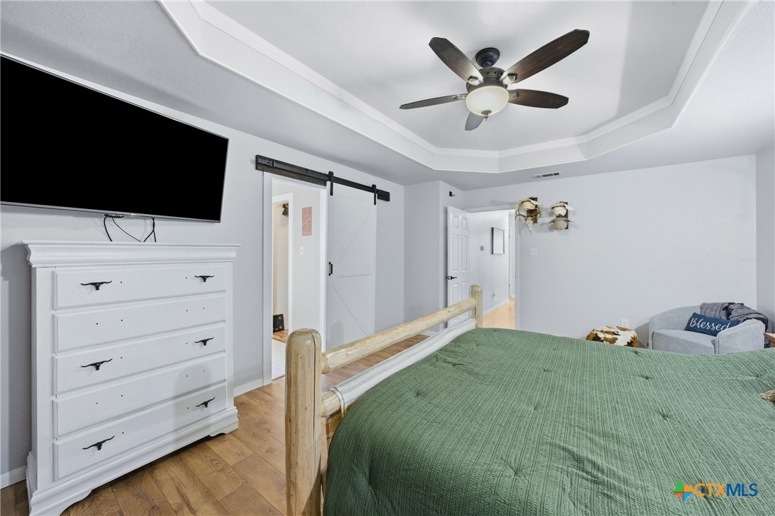 1601 Citation Loop Harker Heights, TX 76548 - Photo 30 of 42 a bedroom with a bed and a flat screen tv