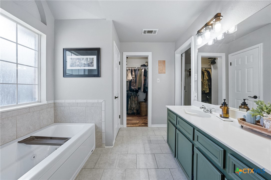 1601 Citation Loop Harker Heights, TX 76548 - Photo 34 of 42 a bathroom with a tub sink and a mirror
