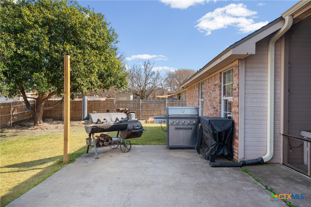 1601 Citation Loop Harker Heights, TX 76548 - Photo 37 of 42 a backyard of a house with barbeque oven table and chairs