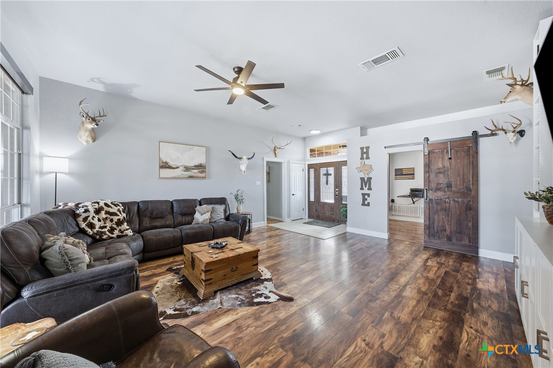 1601 Citation Loop Harker Heights, TX 76548 - Photo 8 of 42 a living room with furniture and a wooden floor