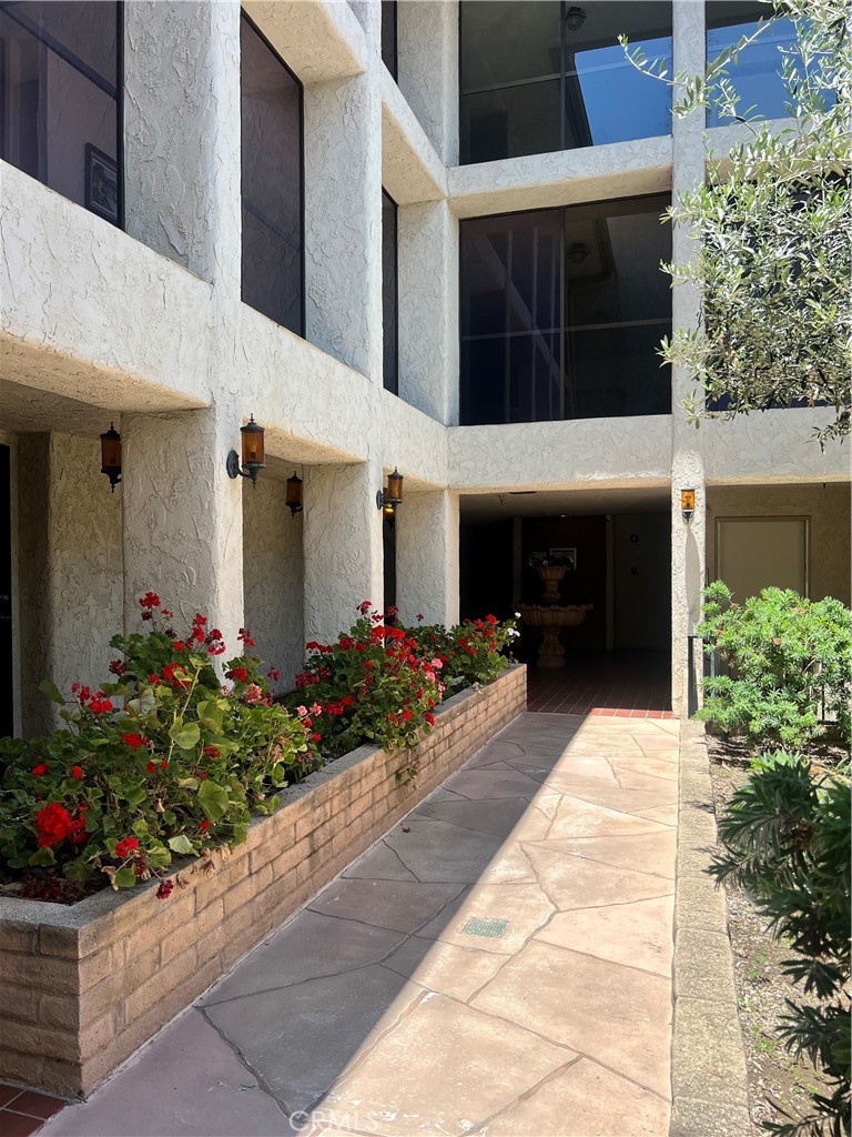 12300 Montecito Road, Unit 24 Seal Beach, CA 90740 - Photo 7 of 8 a front view of a house with a porch