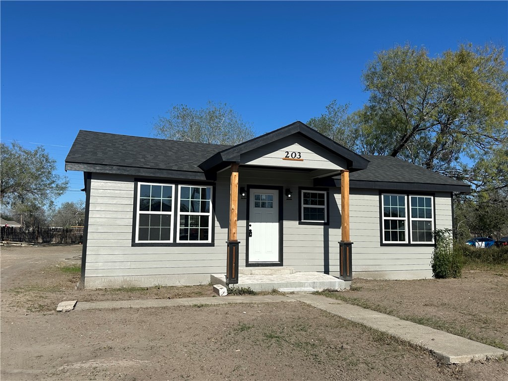 203 East Blair Street Three Rivers, TX 78071 - Photo 4 of 7 front view of a house with a small yard