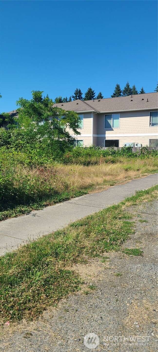 a view of a big yard next to a large building