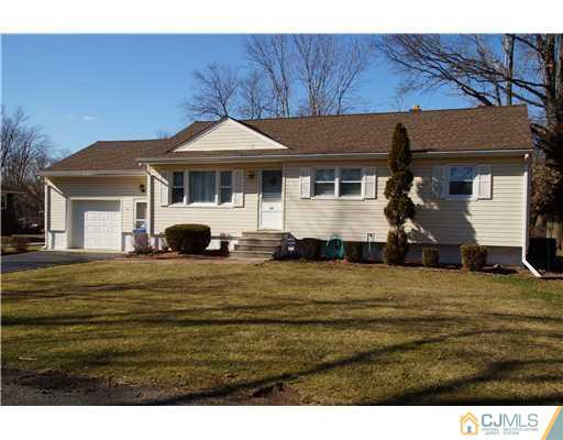 54 Poplar Road Piscataway, NJ 08854 - Photo 1 of 6 a front view of a house with a garden