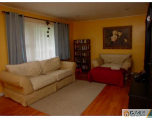 54 Poplar Road Piscataway, NJ 08854 - Photo 2 of 6 a living room with furniture