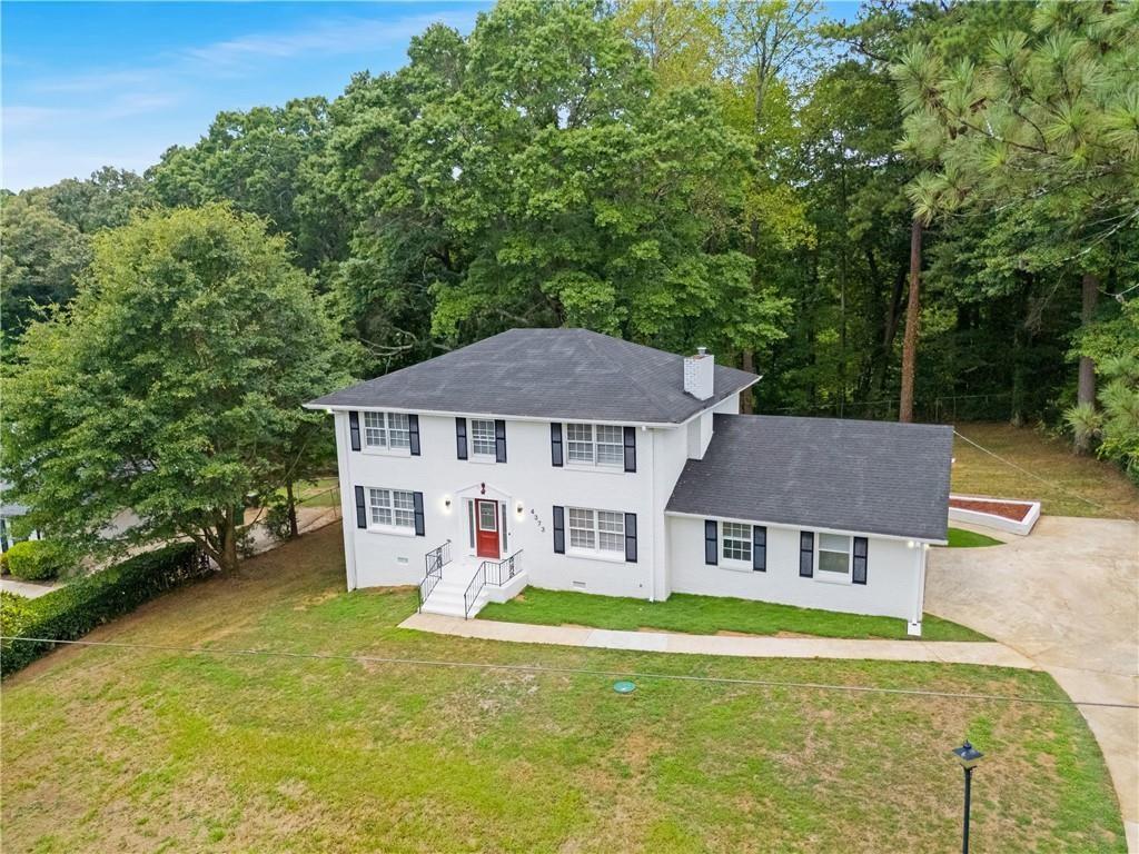 4373 Buckingham Circle Decatur, GA 30035 - Photo 1 of 40 front view of a house with a yard