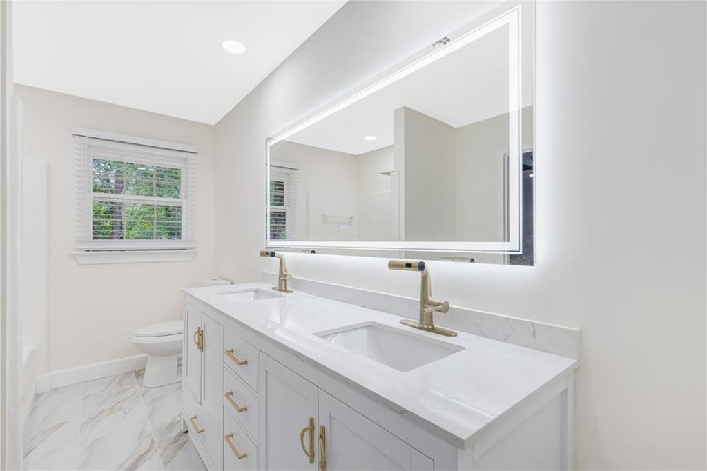 4373 Buckingham Circle Decatur, GA 30035 - Photo 16 of 40 a bathroom with a sink and a mirror