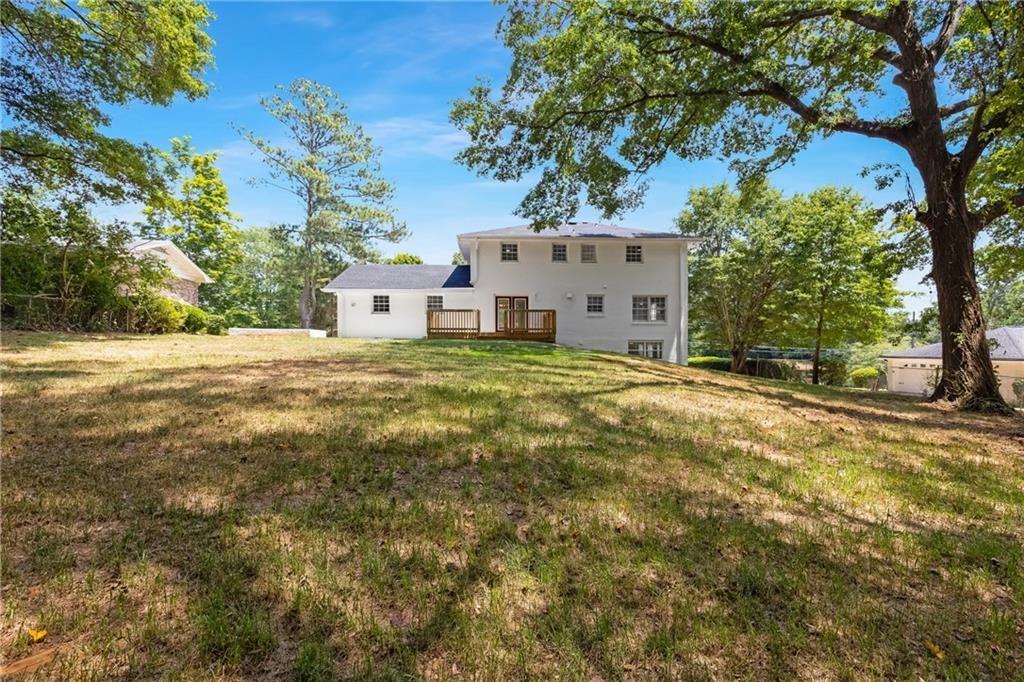 4373 Buckingham Circle Decatur, GA 30035 - Photo 21 of 40 a white house that has a tree in front of it