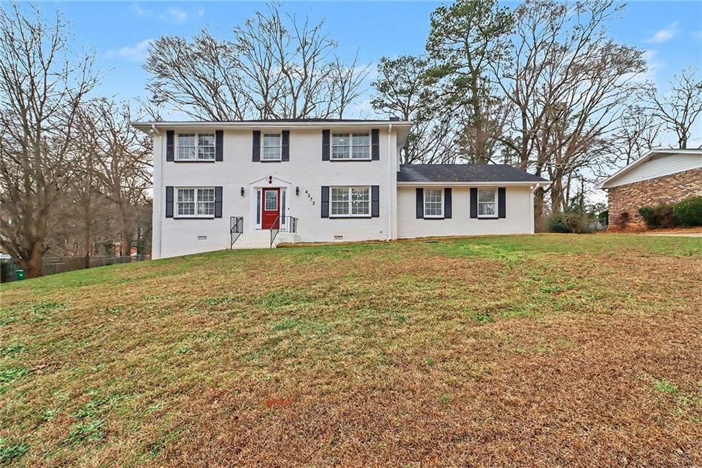 4373 Buckingham Circle Decatur, GA 30035 - Photo 29 of 40 a front view of house with yard and trees around