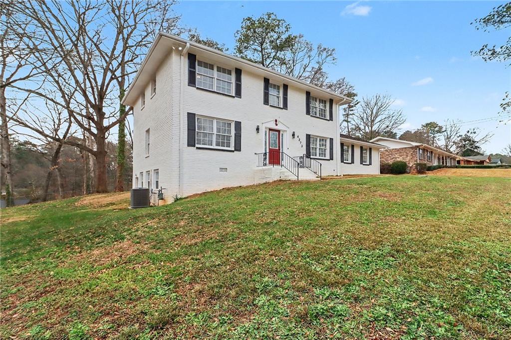 4373 Buckingham Circle Decatur, GA 30035 - Photo 30 of 40 a front view of a house with a yard