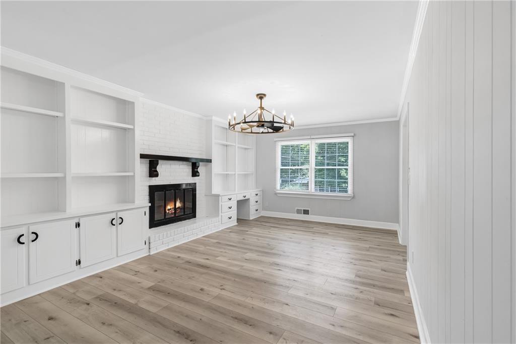 4373 Buckingham Circle Decatur, GA 30035 - Photo 7 of 40 a view of an empty room with a window and fireplace
