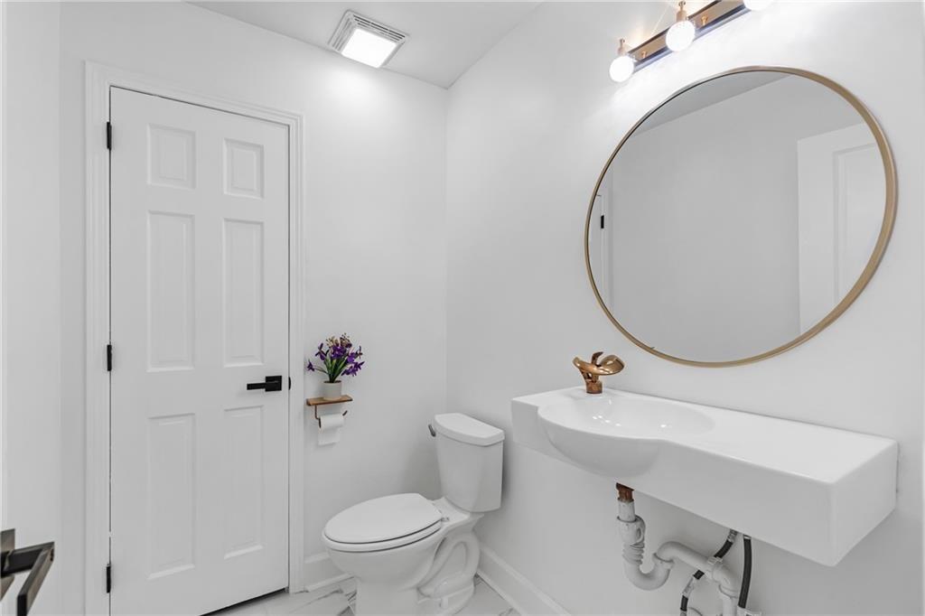 4373 Buckingham Circle Decatur, GA 30035 - Photo 9 of 40 a bathroom with a sink mirror and toilet