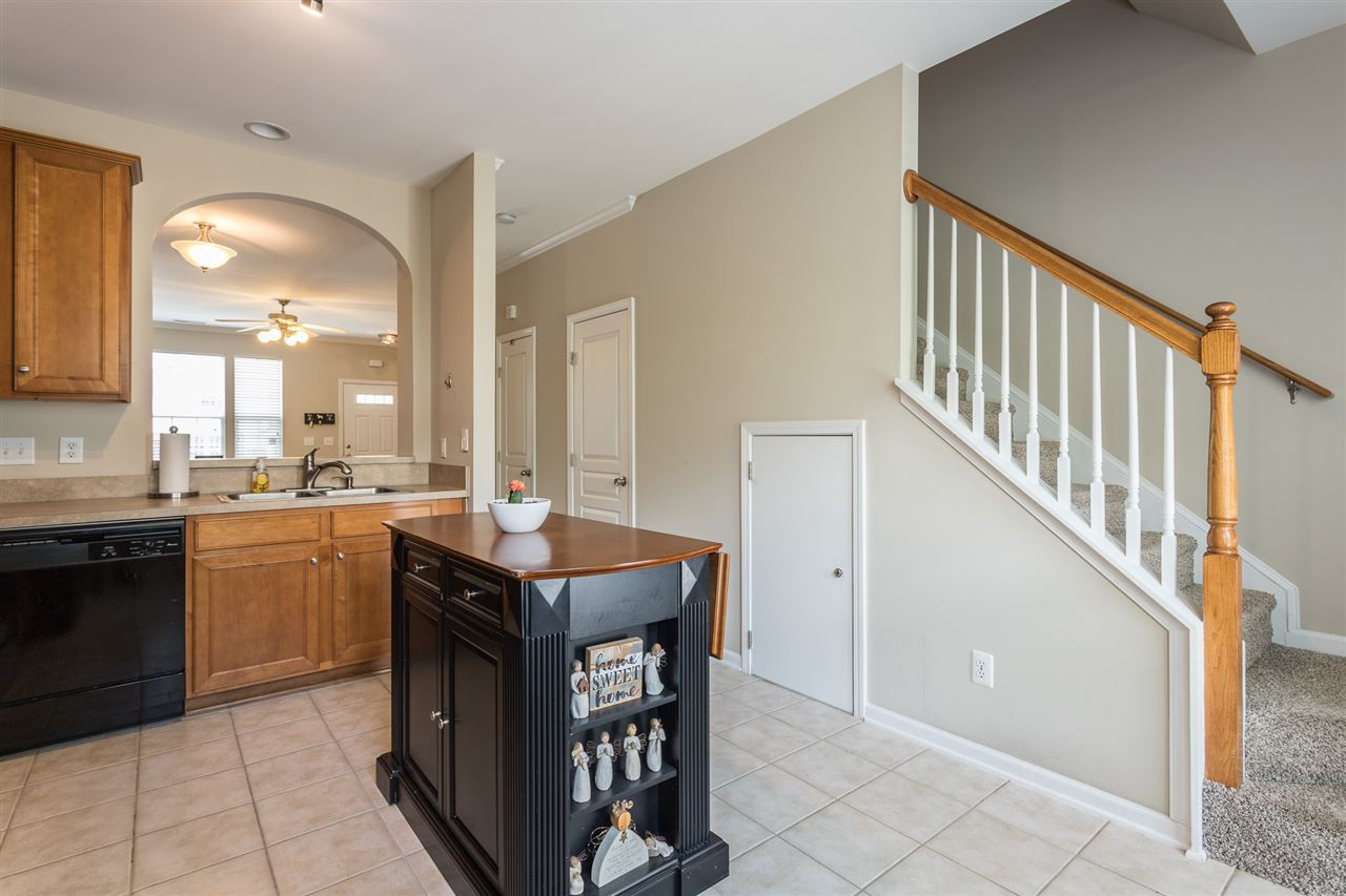 5331 Crescentview Parkway Raleigh, NC 27606 - Photo 13 of 20 With a view of stairs to the second floor bedrooms. Kitchen