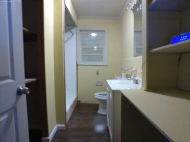 a view of a wooden house with a yard