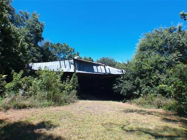a view of a room with wooden roof