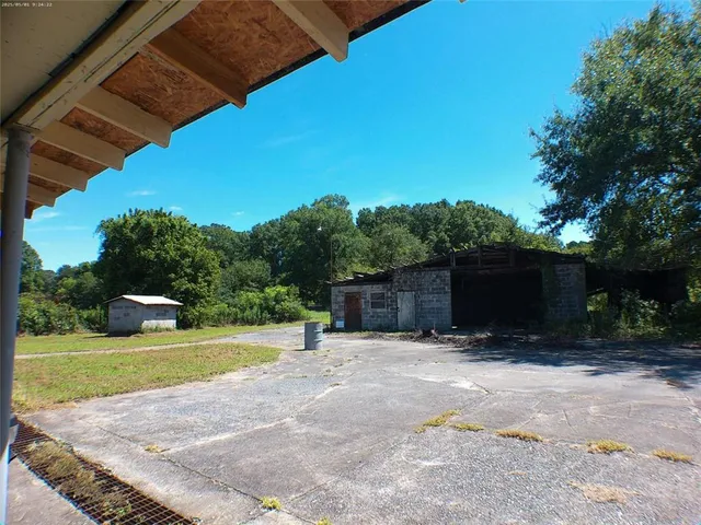 a view of backyard with a garden and entertaining space